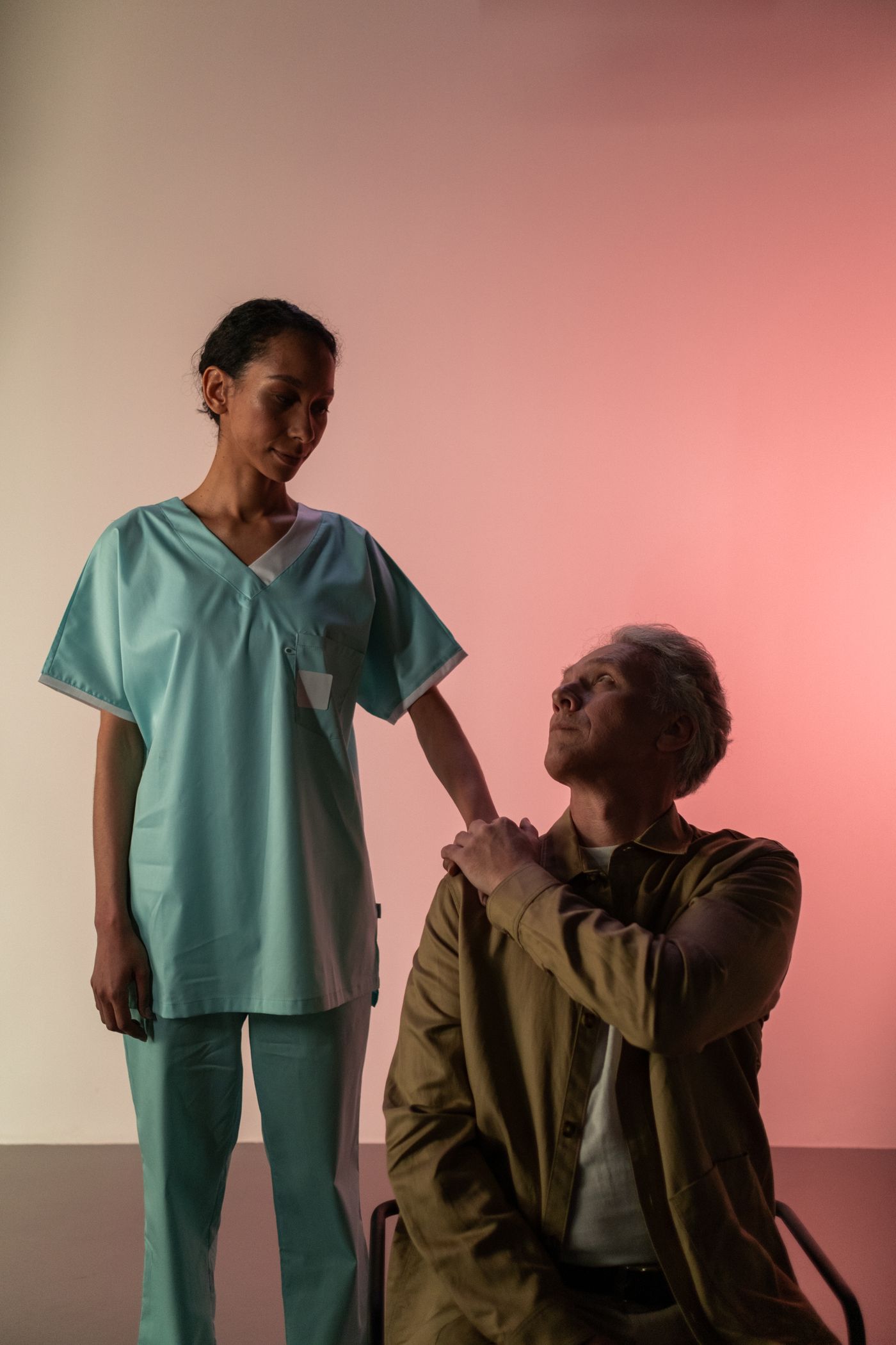 A Magnet nurse comforting an elderly patient