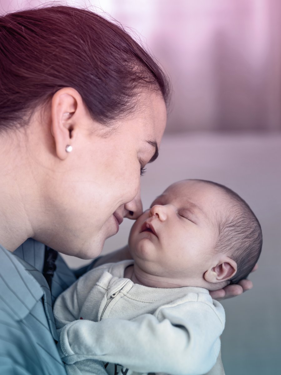 Mother holding her newborn