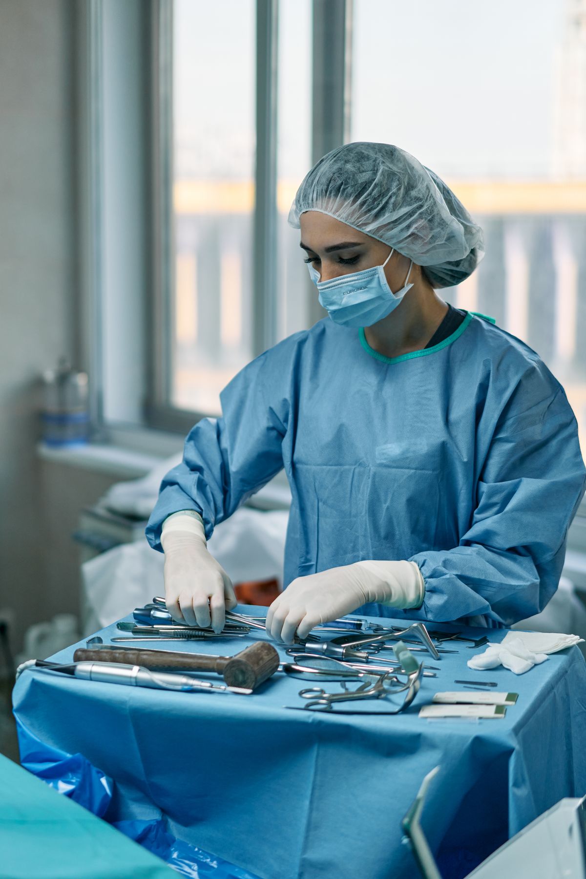 A surgical specialist preparing instruments
